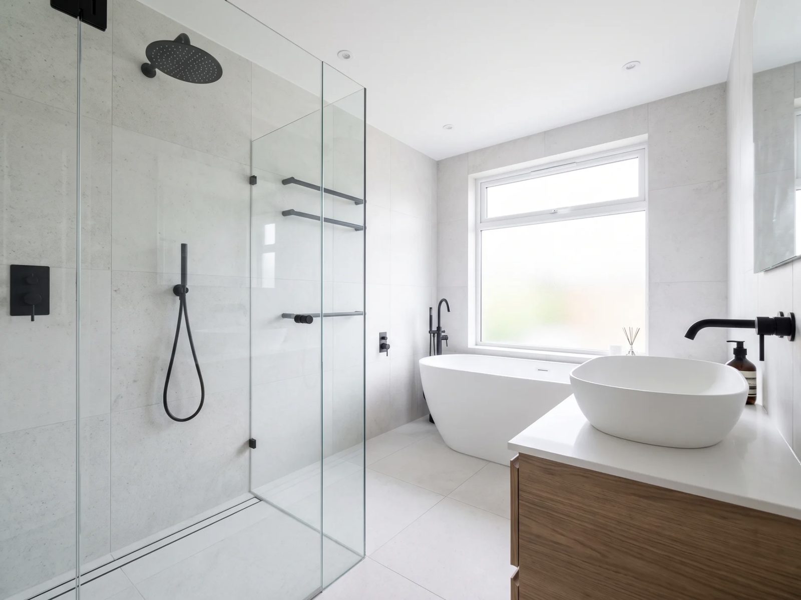Newly fitted modern bathroom with walk-in shower by Plumbing Done Right